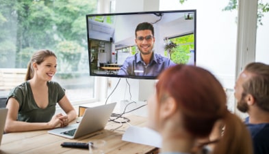 Remote and in-office employees video conferencing with GoTo 